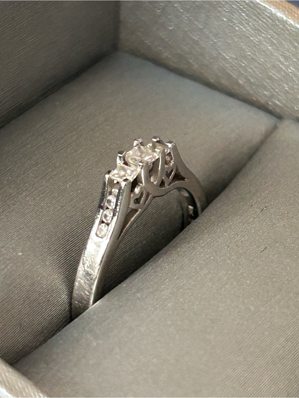 10K White Gold Ring 1/4 Ct princess cut 
3 main stones, purchased from Zales 6